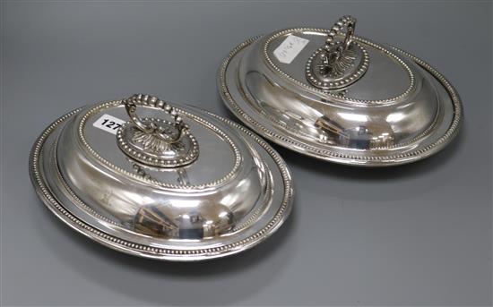 A pair of Victorian plated oval lidded entree dishes length 29cm